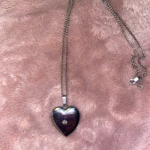 Heart locket with diamond.